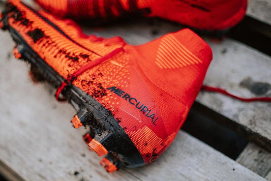Muddy football boot in need of cleaning