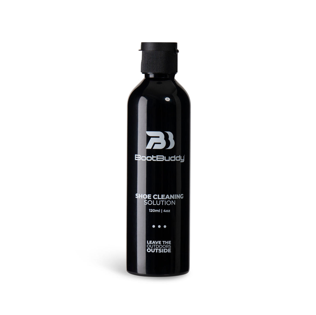 Black bottle of BootBuddy shoe cleaning foam with logo and slogan.